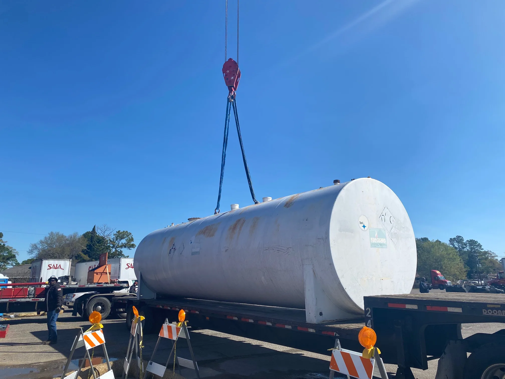 Lamar crew setting a large aboveground fuel storage tank